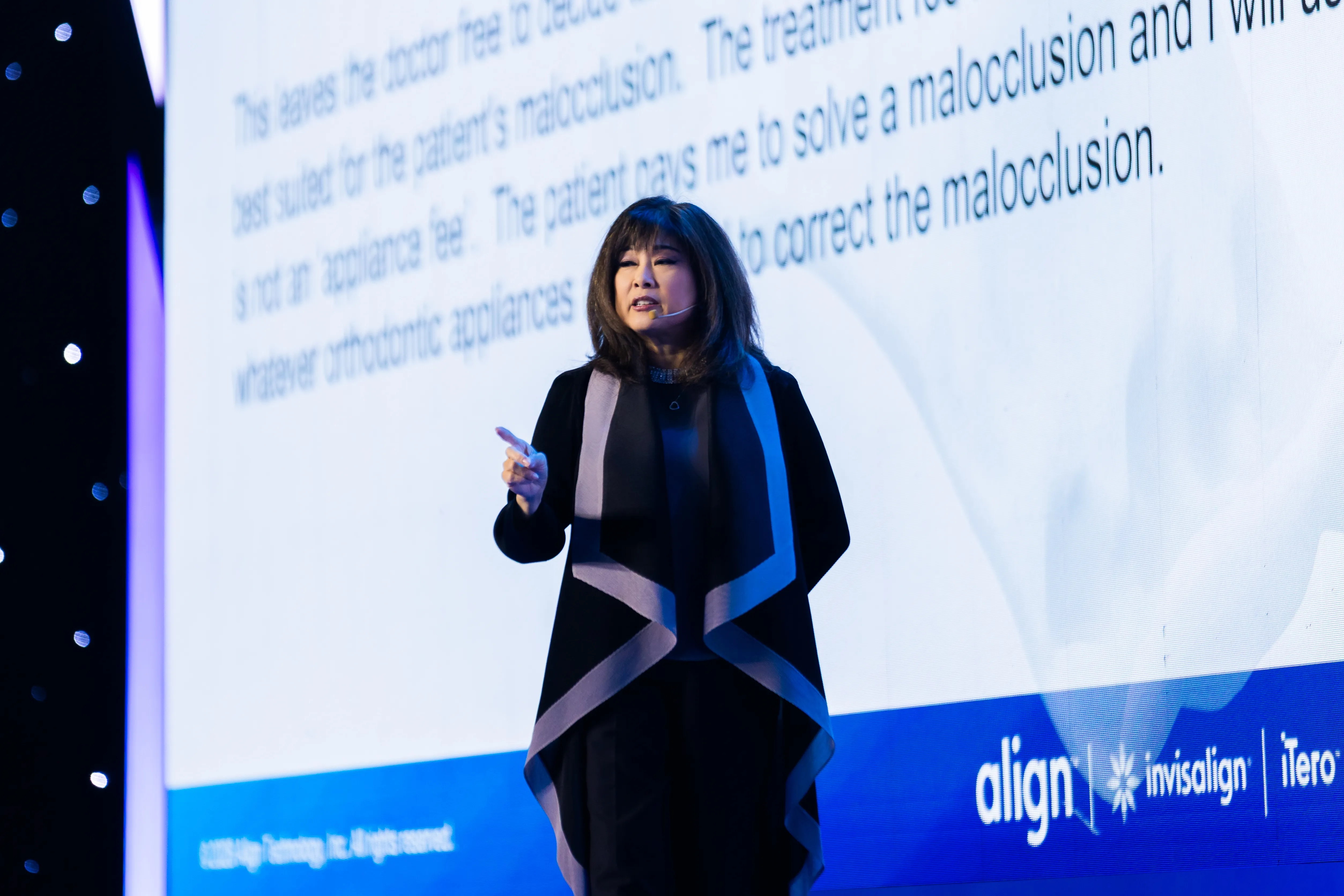 Dr. Sandra Khong Tai speaking at an orthodontic conference